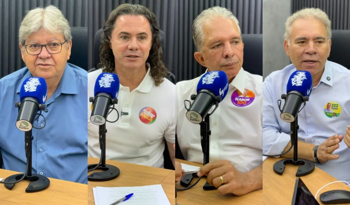 Urna eletrônica com bandeira da Paraíba ao fundo