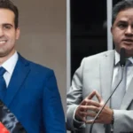 Urna eletrônica em destaque em uma zona eleitoral durante o dia de votação na Paraíba.